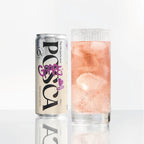 Grape juice can and glass with pink liquid on a white background