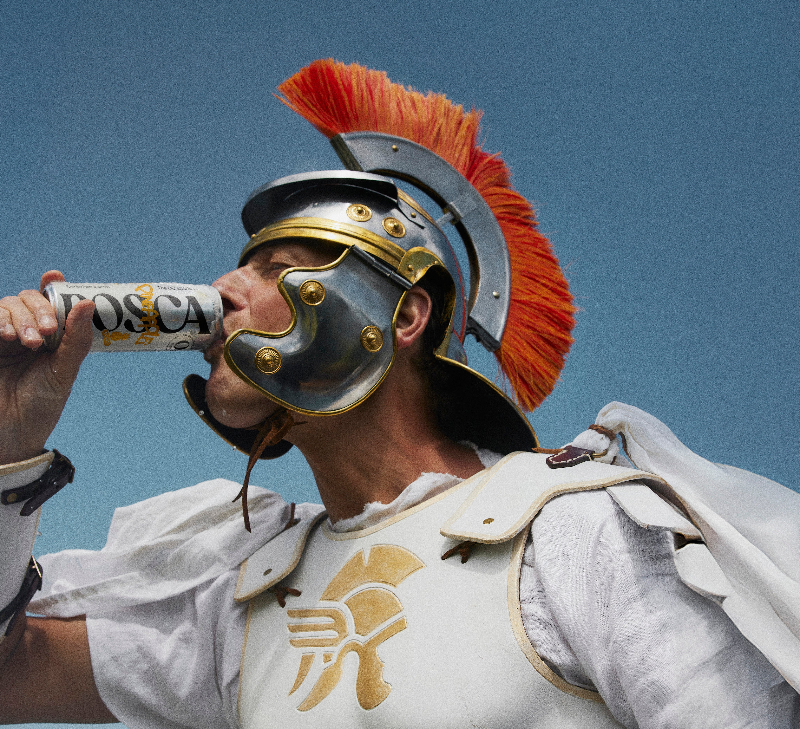 A Roman Gladiator drinking a can of POsca Hydrate