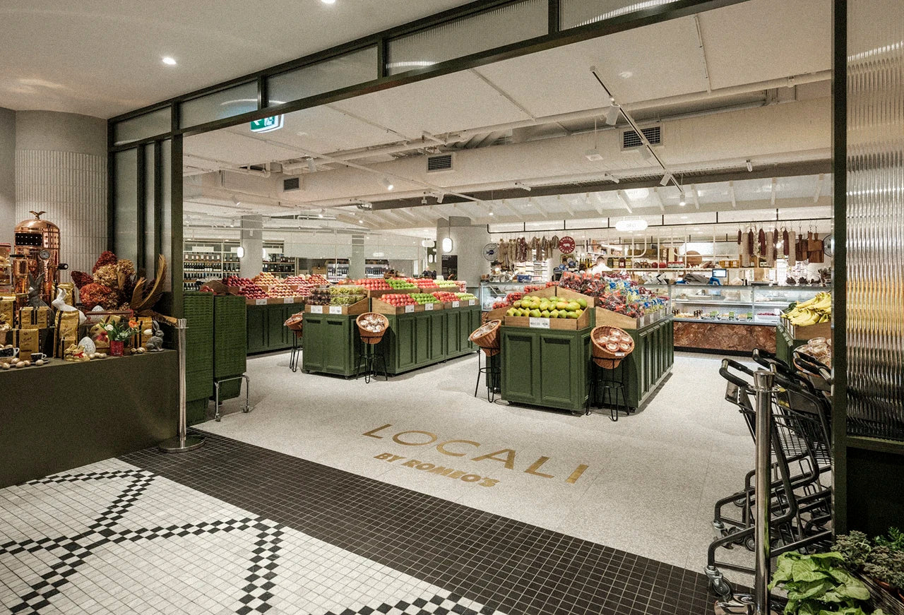 Supermarket interior with 'LOCALI' branding on the floor.